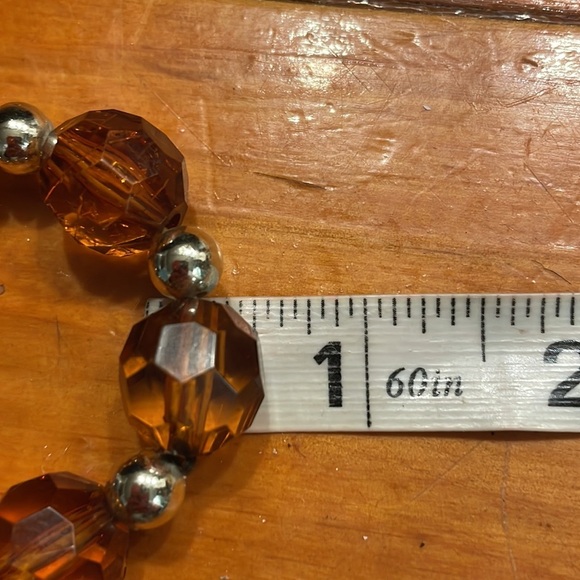 8” stackable stretch bracelet with 8 amber color & 9 silver tone beads - Picture 12 of 13